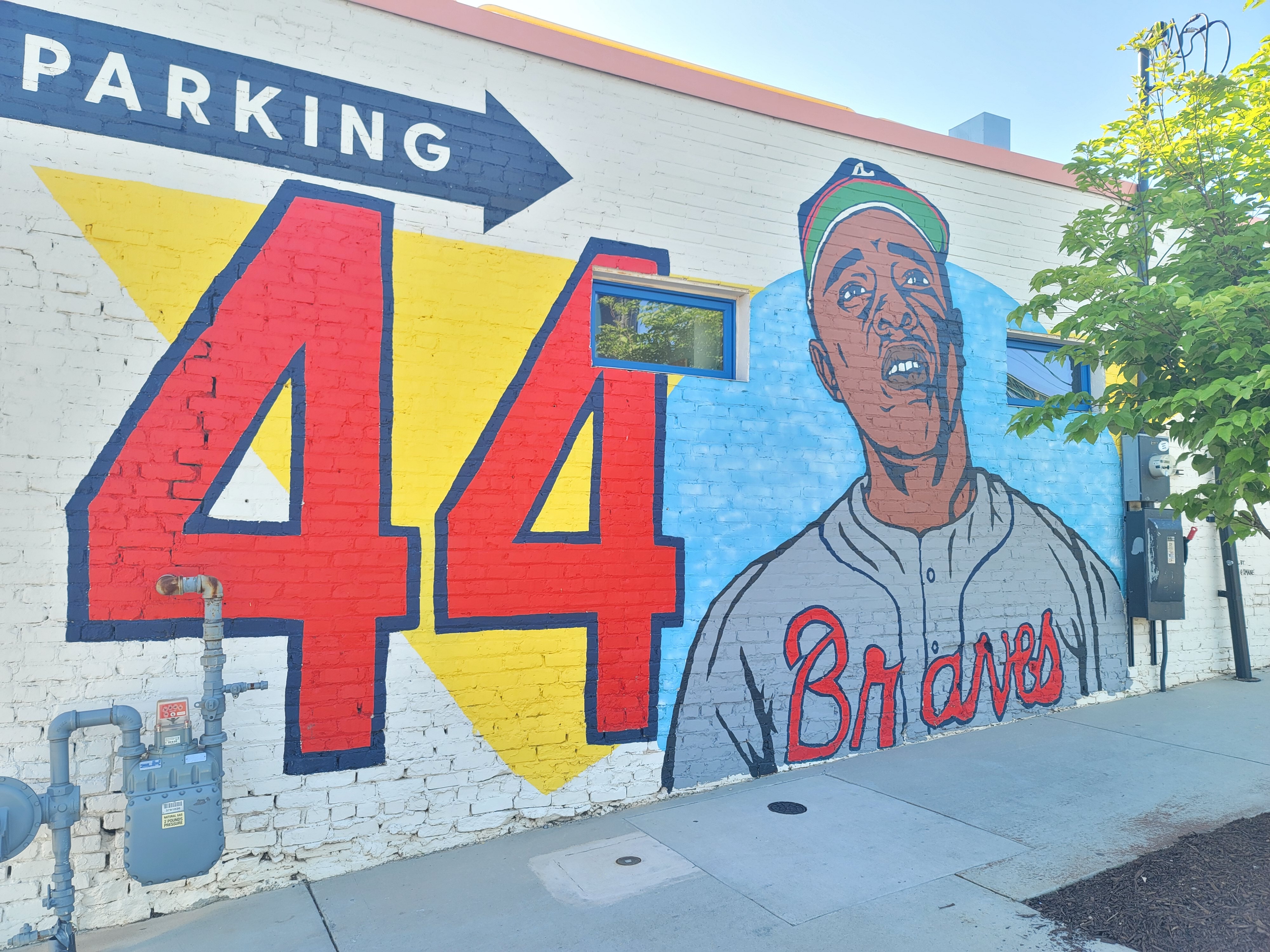 Mural painted on a brick wall of a baseball player #44